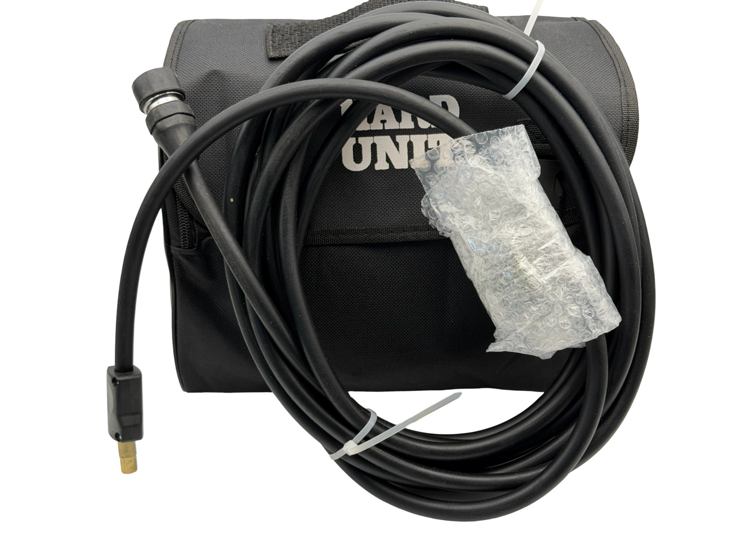 Black air compressor with hose and nozzle on a white background